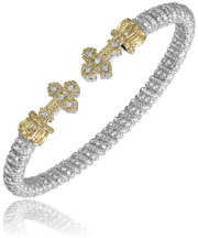 The Alwand Vahan Jewelry sterling silver bracelet boasts a 4mm band with a textured, rope-like design and two intricately detailed 14k gold cross motifs. Each cross, serving as the clasp at the center of the bracelet, is adorned with small, sparkling diamonds totaling 0.10 carats.