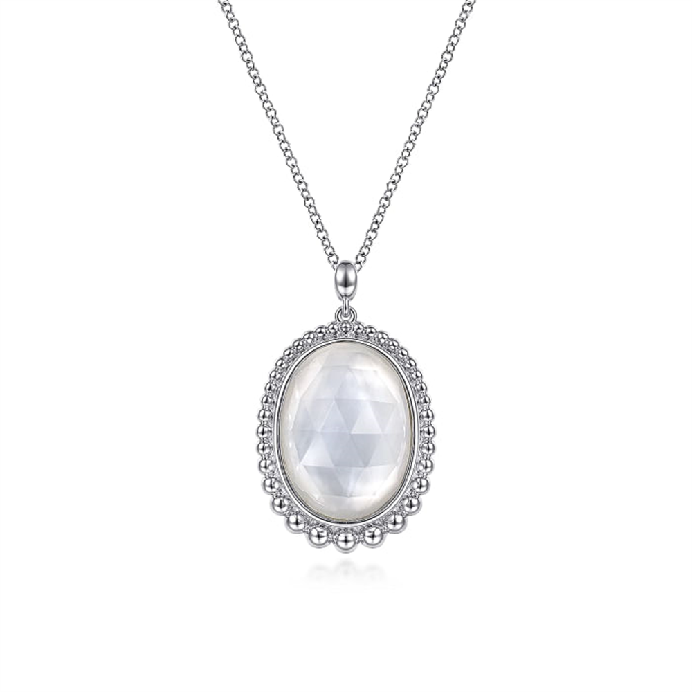 The Gabriel & Co 925 Sterling Silver Rock Crystal and White MOP Pendant Necklace features a delicate chain and an oval pendant with a faceted rock crystal, surrounded by a beaded silver border. The pendant's intricate design adds elegance, making it a standout piece from the Bujukan Collection.