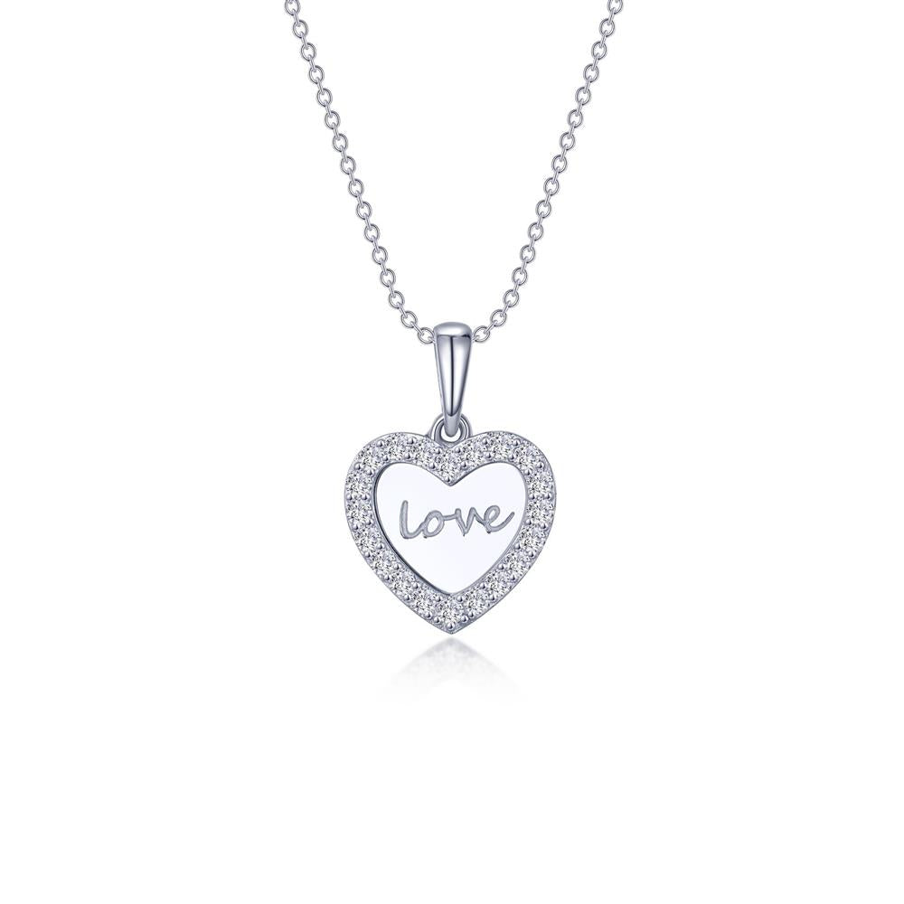 The Love Heart Necklace by Lafonn is a sterling silver pendant featuring a heart-shaped charm adorned with small gemstones along its border. Elegantly written in cursive at the center of the heart is the word "love." This exquisite pendant hangs from a delicate silver chain, showcasing timeless classics and Lassaire simulated diamonds.