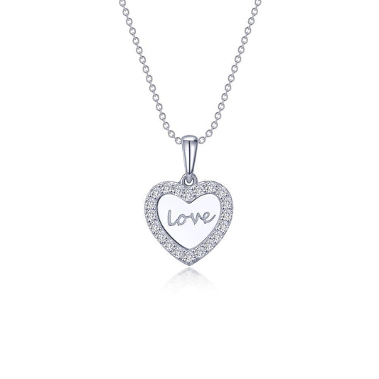 The Love Heart Necklace by Lafonn is a sterling silver pendant featuring a heart-shaped charm adorned with small gemstones along its border. Elegantly written in cursive at the center of the heart is the word "love." This exquisite pendant hangs from a delicate silver chain, showcasing timeless classics and Lassaire simulated diamonds.