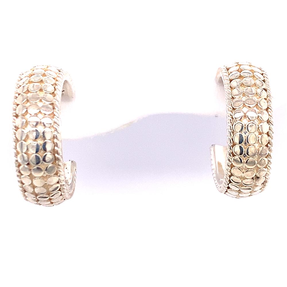 The Sterling Silver Dome Hoop Earrings from Anna Beck Designs feature a gold-tone dome shape with a pebble-like pattern. The wide-band design showcases intricate, shimmering details that reflect light beautifully. Presented on a white background, these earrings highlight sterling silver accents that add an extra touch of elegance.