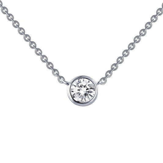 A close-up image of the 1/2 Carat Diamond Solitaire Necklace by Lafonn showcases a delicate sterling silver chain and a single round-cut simulated diamond pendant set in a simple bezel. The necklace boasts a minimalist and elegant design.