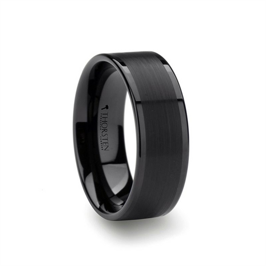 The VULCAN ring by Thorsten features a sleek flat black tungsten design with a brushed center and polished beveled edges. The inside of the ring bears the stylish inscription "THORSTEN," embodying a modern and bold aesthetic.