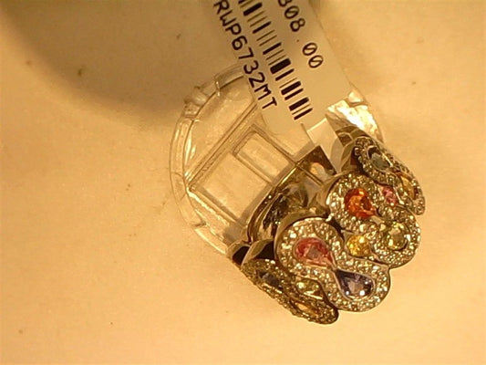 The Ryan Gems Multi-colored diamond and sapphire ring in 14k white gold, size 7, features various shaped gemstones and is decoratively displayed on a clear stand with a white barcode tag.