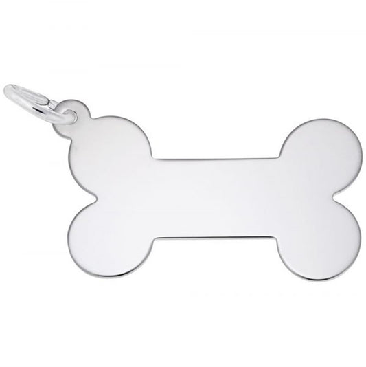 Rembrandt Charms offers an Engravable Dog Bone Flat Charm in sterling silver, featuring a sleek, reflective surface with a keyring at the top left corner. The charm is blank and comes with an elegant paw print accent.