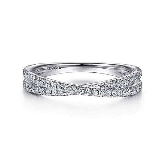 The 14K White Gold Criss Cross Diamond Stackable Ring by Gabriel & Co. boasts a sleek design with an intricate crisscross pattern, embellished with two rows of small, sparkling diamonds. This elegant setting enhances the brilliance and sophistication of the gems, giving the ring a luxurious and refined appearance.