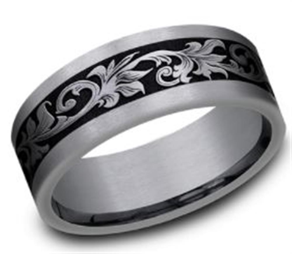 The 8mm Tantalum and Black Titanium Vintage Script Ring by Benchmark Rings showcases a brushed silver exterior. The ring's center highlights a black band adorned with an intricate silver floral pattern, adding an elegant touch. Crafted from black titanium, the ring boasts a polished finish on the interior.