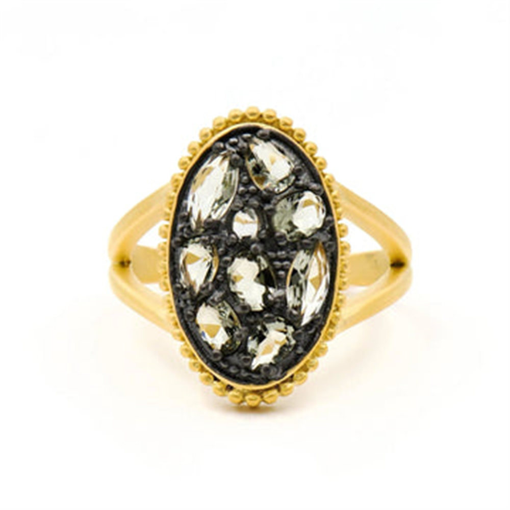 The Freida Rothman Rose D'or Oval Radiance Ring (RDYKGR01-7), size 7, features an oval face with clear marquise-cut gemstones on a black background, textured gold border, and split shank band.
