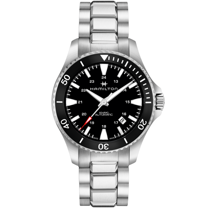 The Hamilton Khaki Navy Scuba Automatic Watch features a silver stainless steel band, a ceramic bezel, and a black dial with white hour markers. This timepiece displays both 12-hour and 24-hour formats, includes a date window at the 4 o’clock position, and boasts an impressive water resistance of up to 300 meters.