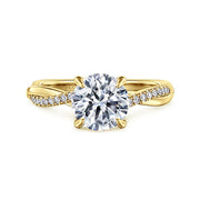 The Gabriel & Co 14K Yellow Gold Round Twisted Diamond Engagement Ring (1.50 carats) showcases a lab-grown center stone and a twisted band embellished with small diamonds for added brilliance.