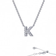 Introducing the Letter K Pendant Necklace by Lafonn, a timeless piece featuring a silver pendant encrusted with genuine sparkling stones. The delicate chain has a simple clasp and extends elegantly below the image.