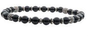 The INOX Black Agate Stones with Black Oxidized Beads Bracelet exudes style with its black agate stones and silver-accented beads, all threaded on an elastic band. These grounding and protective crystals form a simple yet elegant design that enhances any casual or formal outfit.