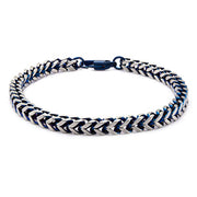 The Steel Blue IP Franco Chain Bracelet by INOX showcases a sleek design with intertwined silver and blue chevron links, secured with a blue clasp. This 8-inch men's stainless steel bracelet embodies modern style and sophistication.