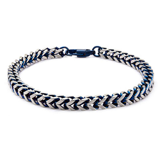 The Steel Blue IP Franco Chain Bracelet by INOX showcases a sleek design with intertwined silver and blue chevron links, secured with a blue clasp. This 8-inch men's stainless steel bracelet embodies modern style and sophistication.