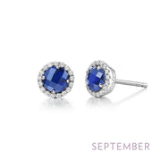 Introducing the September Birthstone Sapphire Earrings by Lafonn: These elegant stud earrings showcase round lab-grown sapphires, each encircled by a halo of shimmering simulated diamonds. The image features the word "SEPTEMBER" in purple text at the bottom right corner.
