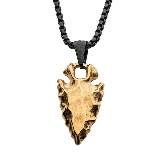 An 18K gold plated chiseled arrowhead pendant from the INOX brand, featuring a jagged design on its surface, hangs from a high-polished rectangular link box chain necklace that measures 24 inches in length.
