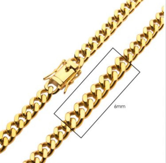 Close-up of the INOX 6mm 18K Gold Plated Miami Cuban Chain necklace, measuring 24 inches in length. The men's necklace features closely interlinked flat, polished links and has a clasp mechanism for fastening.