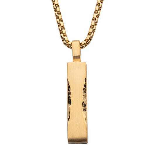 The Matte 18K Gold IP Chiseled Engravable Drop Pendant with Box Chain by INOX features a rectangular drop pendant with a hammered texture. The men's matte gold pendant is suspended vertically from the box chain, showcasing a polished and rugged finish.