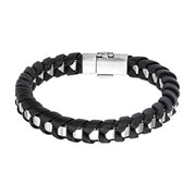 The INOX Men's Stainless Steel Bracelet showcases a sophisticated 8-inch design, blending black leather and silver metal links in an intricate woven pattern. This stylish bracelet is further enhanced by a sleek, silver clasp for secure fastening.