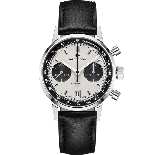 The Intra-Matic Automatic Chronograph Watch by Hamilton, featuring a panda dial, comes in silver and black with a black leather strap. The watch face includes three sub-dials positioned at the 3, 6, and 9 o'clock spots and a date display at the 6 o'clock mark. The brand name "Hamilton" is printed on the face.