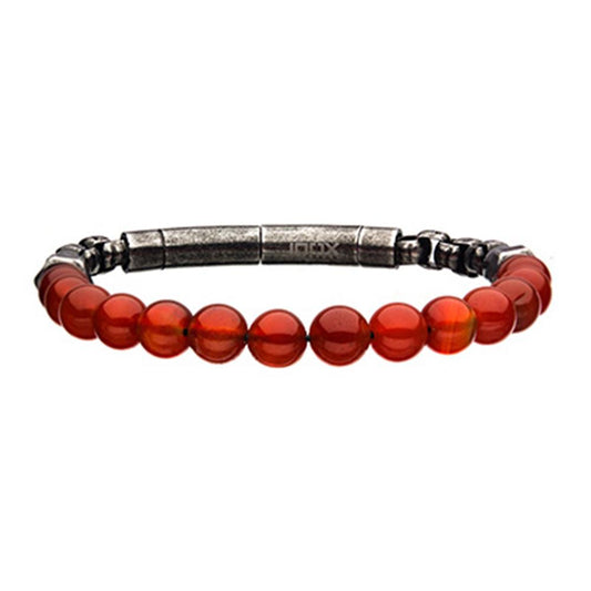 The INOX 8mm Red Agate Beads and Box Chain Bracelet is a men's accessory that showcases smooth, round red agate beads strung on a black cord with a silver-toned metal clasp. The evenly spaced beads form a semi-circle, accentuating the warm, earthy tones of the natural stones.