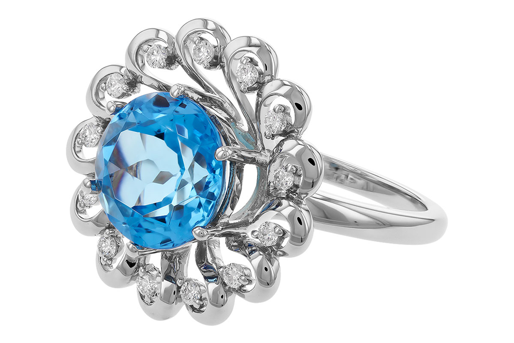 The Allison Kaufman Swiss Blue Topaz and Diamonds 14k White Gold Ring features a beautiful silver band with an intricate floral design, highlighting a large round Swiss blue topaz at its center, surrounded by shimmering diamonds.