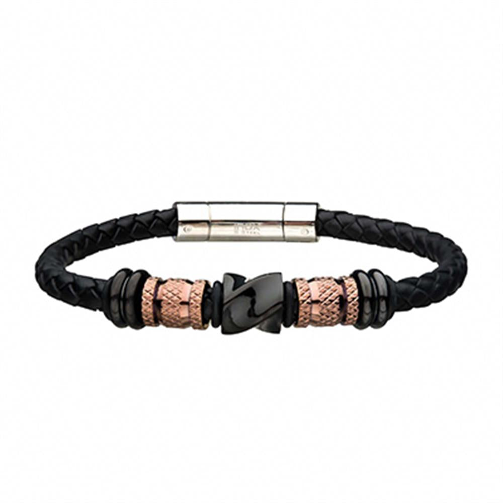 The Men's Stainless Steel Black Bracelet by INOX is meticulously crafted from black braided leather and features eye-catching rose gold plated and black cylindrical beads. It includes a sleek silver-tone barrel clasp, with the central beads adorned in intricate patterns for a stylish and sophisticated touch.