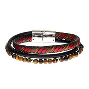 Presenting the Men's Stainless Steel Tiger Eye Bracelet by INOX, a stylish accessory crafted with braided leather in red, black, and brown tones. It features a row of Tiger Eye beads and is finished with a polished metal clasp for a modern yet rustic appeal.