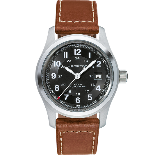 A close-up of the Hamilton Khaki Field Automatic Watch | 42mm, showcasing its silver case, black dial, and white hour markers. Featuring an H-10 automatic caliber with an impressive 80-hour power reserve, it includes a date window at the 3 o'clock position and is paired with a brown leather strap adorned with white stitching.
