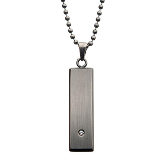 The INOX Stainless Steel with 2mm Clear CZ Tag Pendant features a simple and elegant design, showcasing a rectangular metallic pendant adorned with a small clear gemstone at the bottom. The pendant gracefully hangs from a ball chain composed of small, round beads.