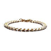 A Men's Denim Fade Stainless Steel Bracelet from INOX features a lobster clasp and sleek, polished finish. The diamond-cut curb design includes interlocking links, offering a sophisticated and elegant appearance. The bracelet is laid out flat on a white background.