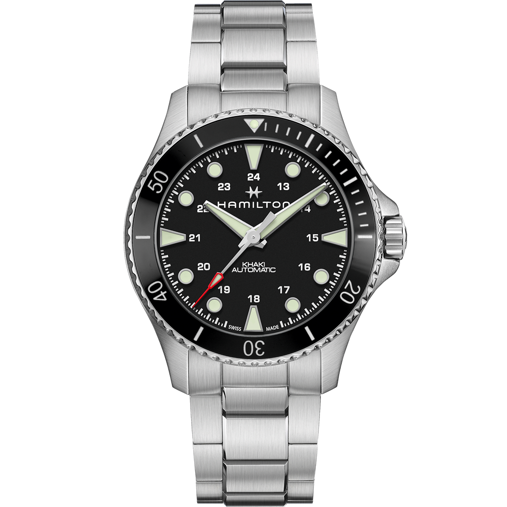 A Hamilton Khaki Navy Scuba Automatic Watch features a 43mm case, silver metal band, black dial with luminous hands and hour markers, date display at the 4 o’clock position, a unidirectional ceramic bezel, and a 24-hour scale.
