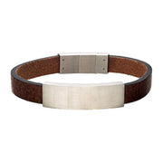 The INOX Men's Brown Leather with Steel Buckle ID Bracelet | 8.5" Adjustable features a minimalist and stylish design, boasting a broad strap with a textured finish. Its silver rectangular plate at the center and matching silver clasp enhance its look, while the self-adjustable link ensures a perfect fit for any wrist size.