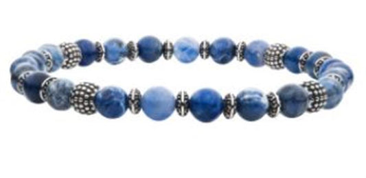 The INOX Men's 6mm Blue Sodalite Stones with Black Oxidized Beads Bracelet showcases an exquisite design with polished blue sodalite stones varying in shades that alternate with silver-colored ornamental and black oxidized beads, adding a dynamic, textured appearance and sophisticated elegance to the bracelet.