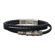 The Men's Stainless Steel Black Plated Bracelet with Antique Gunmetal Beads by INOX features a double-band design with braided and smooth leather textures, adorned with multiple antique gunmetal beads and a matching rectangular clasp.