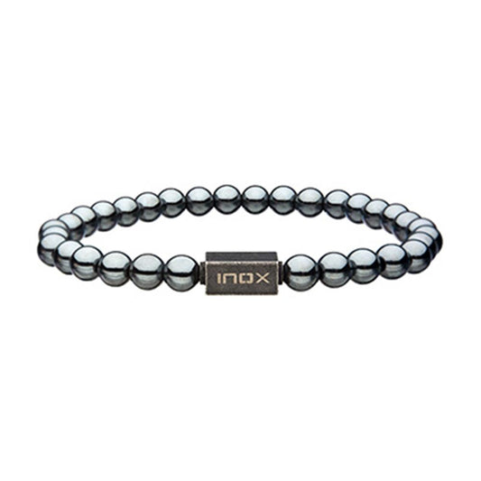 The INOX Men's 6mm Hematite Gemstone Stretch Bead Bracelet with Steel Clasp features metallic spherical beads and a central rectangular bead engraved with "INOX." Its hematite gemstone beads are evenly spaced around for a stylish and balanced look.