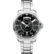 The Hamilton Khaki Aviation Pilot Day Date Automatic Watch boasts a stainless steel band, complemented by a black dial featuring silver-tone numerals and hands. It includes a day-date display at the 12 o'clock position and a sub-dial for 24-hour time indication, making this vintage timepiece an exquisite blend of functionality and classic style.