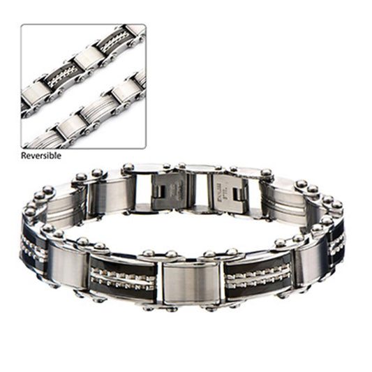 Introducing the Men's Stainless Steel Black IP & Steel Edge Reversible Bracelet with S by INOX. This silver-toned reversible men's bracelet boasts a sleek stainless steel finish and features alternating links of brushed and polished textures. The inset image offers a close-up view of the bracelet's self-adjustable design, emphasizing the stunning dual-finish detail on the links.