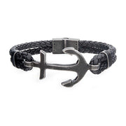 The Men's Black Antiqued Double Leather Bracelet from INOX is a stylish accessory featuring a large metallic anchor charm as its centerpiece. Crafted from intertwined black leather, it boasts adjustable loops on either side of the anchor, serving as the clasp. This bracelet perfectly blends a nautical theme with a modern touch.
