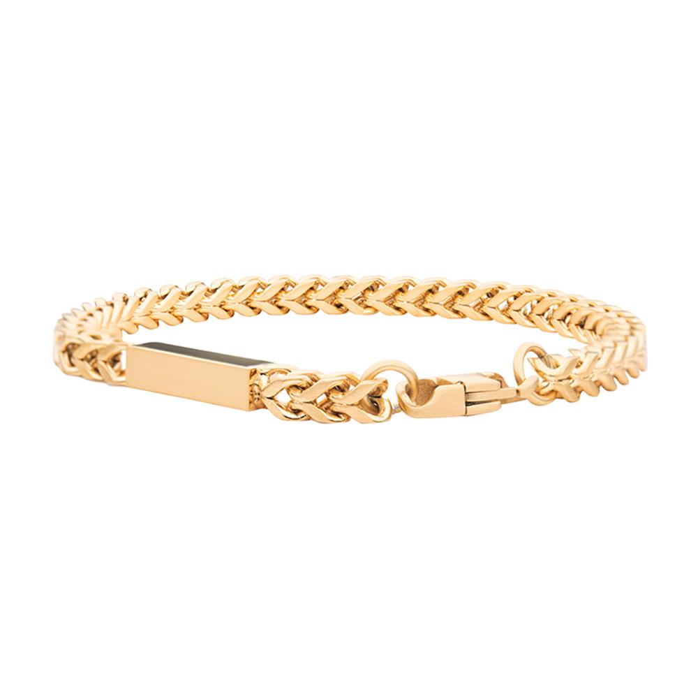 The Engravable ID Block Bracelet by INOX features a polished rectangular ID plate at its center. This men's bracelet boasts a double-link Franco chain design and a secure clasp closure, all crafted in 18K yellow gold.