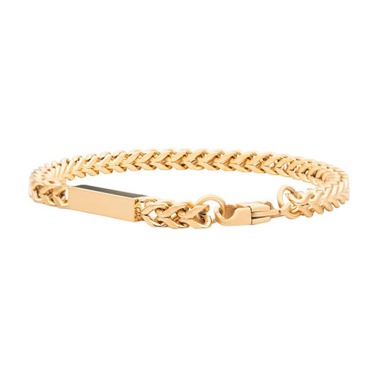 The Engravable ID Block Bracelet by INOX features a polished rectangular ID plate at its center. This men's bracelet boasts a double-link Franco chain design and a secure clasp closure, all crafted in 18K yellow gold.