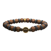 The Men's 10mm Hematite Stone Bracelet by INOX features alternating brown and gray faceted beads on a coppertone silicone string, with a circular gold-colored centerpiece showcasing a cross design and highlighted with hematite stone accents.