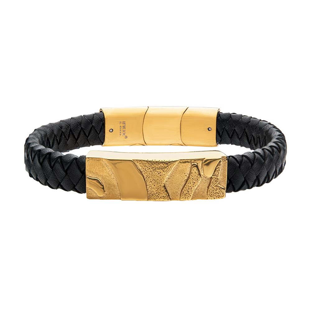 Introducing the Men's Black Leather Bracelet by INOX, showcasing a thick, braided band with a high-polished 18K gold plated magnetic clasp. The clasp features intricate 3D canyon patterns and ensures a smooth closure mechanism.