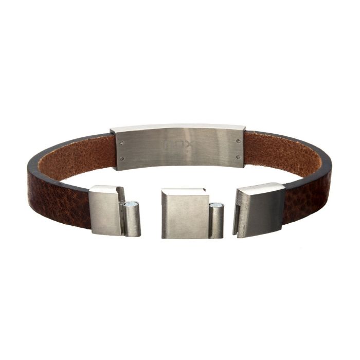 Presenting the Men's Brown Leather with Steel Buckle ID Bracelet by INOX, featuring a sleek silver metallic clasp and sophisticated accents. With its self-adjustable link design, it ensures an impeccable fit for any wrist size. When laid out flat with the interior side up, the bracelet proudly displays its rectangular clasp adorned with a smooth, polished finish.