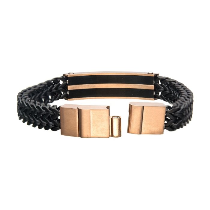 Introducing the INOX Stainless Steel, Black IP & Rose Gold IP Franco Chain Bracelet—a stylish men's accessory featuring a black woven leather band and a central metal plate adorned with two horizontal rose gold-tone stripes. The design is completed with a large rectangular rose gold-tone clasp, enhanced by Double Franco Chain links for an added touch of sophistication.