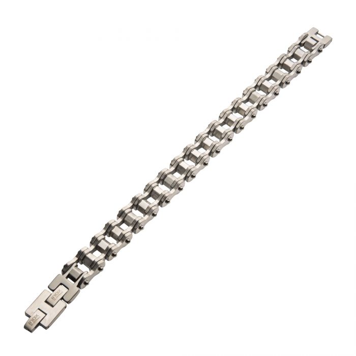 The Steel Bike Chain Bracelet by INOX is a silver-toned men's stainless steel accessory with a robust, industrial design. It features interconnected rectangular links reminiscent of a bike chain and includes a clasp closure at one end, enhancing its mechanical, modern appearance.