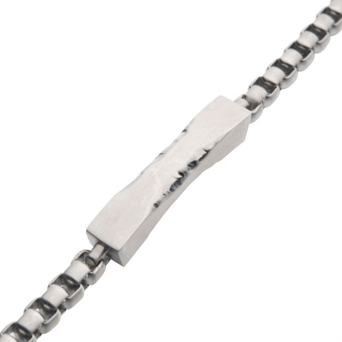 Close-up image of the INOX Matte Steel Chiseled Engravable Drop with Bold Box Chain Bracelet. Featuring a rectangular, textured central bead, this silver men's bracelet has evenly sized, rounded links connected to the central bead, creating a sleek and modern design that's perfect for engraving to add a personalized touch.