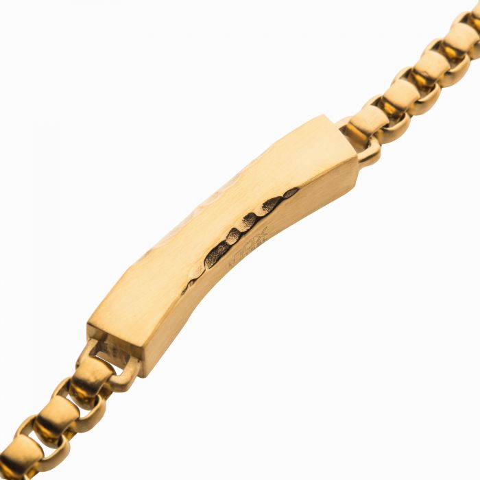 A close-up image of the INOX Matte 18K Gold IP Chiseled Engravable Drop with Bold Box Chain Bracelet. The men's gold bracelet features a chunky rectangular centerpiece and a box chain design with a smooth, polished finish.