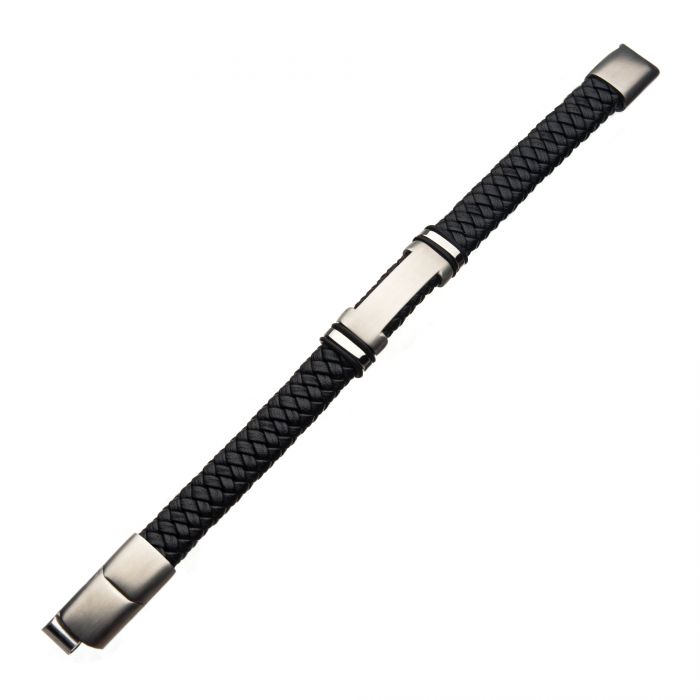 Introducing the INOX Men's Black Leather with Steel ID Bracelet, featuring an adjustable length of 8.25" to 8.75". This bracelet boasts a sleek and modern design with braided leather and silver accents. The slide magnetic clasp ensures convenience, while interspersed metal links add additional style to your look.