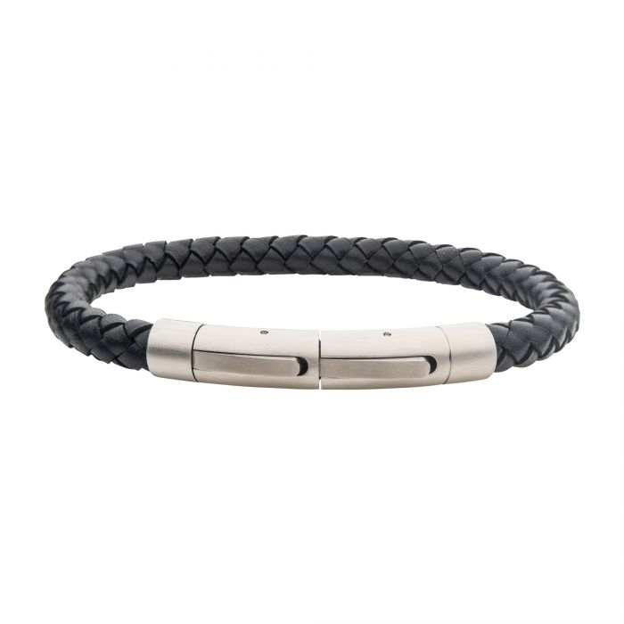 The 6mm Black Leather Bracelet by INOX is a stylish men's accessory featuring a tightly braided black leather band. It is fastened with a sleek, rectangular stainless steel clasp that boasts smooth finishes and subtle grooves for added design detail, resulting in a modern and elegant look.